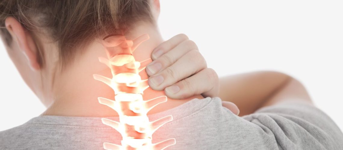 Digital composite of Highlighted spine of woman with neck pain